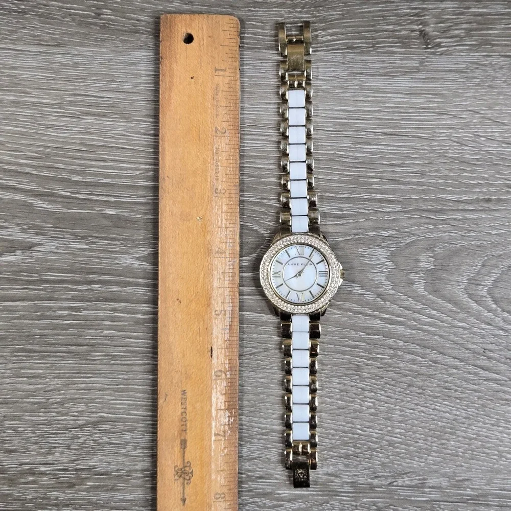 Anne Klein Women's 10/9537MPTTT Mother of Pearl Dial White?Gold Tone Band Watch